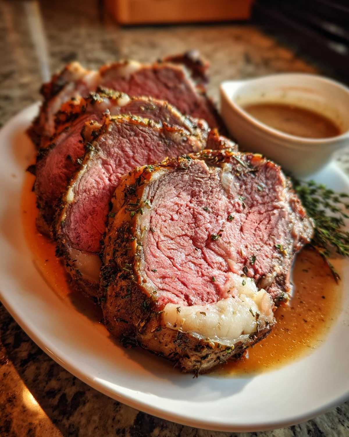 Slices of herb-crusted prime rib roasted to a perfect medium rare, served with au jus.