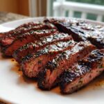 Close-up of perfectly grilled and sliced steak glistening with the amazing carne asada marinade.